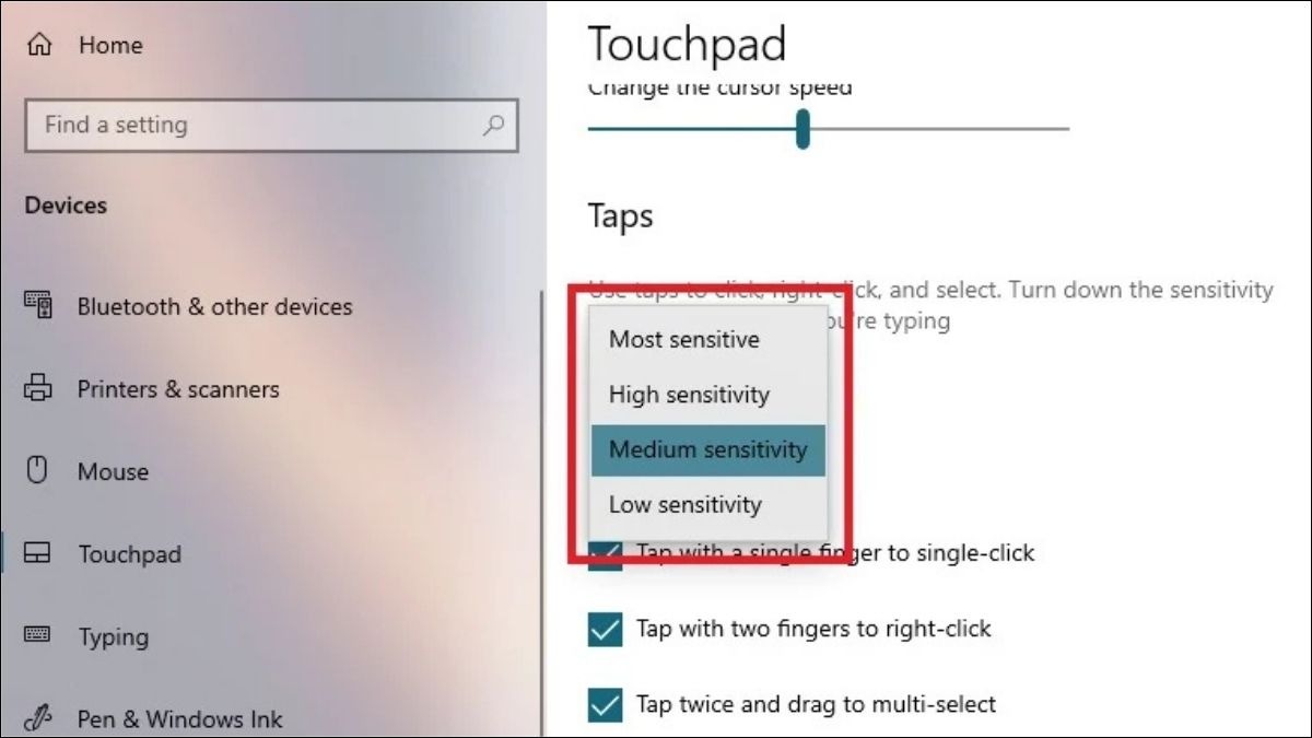 Trong phần Touchpad sensitivity (Độ nhạy của bàn di chuột), chọn mức độ nhạy phù hợp