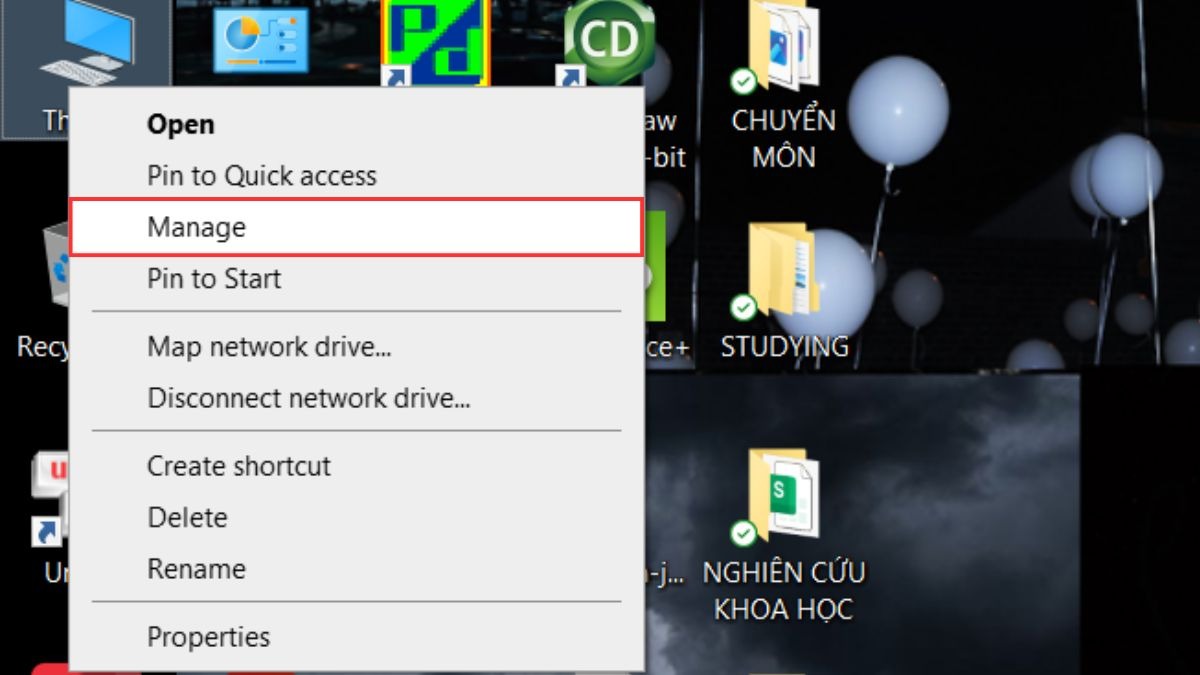 Nhấn chuột phải vào biểu tượng This PC (hoặc My Computer) trên màn hình desktop, sau đó chọn Manage.