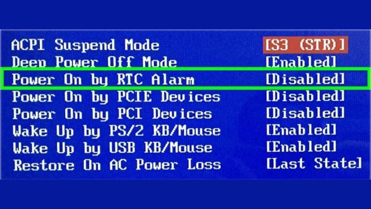 Tìm kiếm tùy chọn hẹn giờ, thường có tên là RTC Wake Up, Power On Alarm, RTC Alarm...